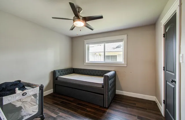 a bedroom with bed and window