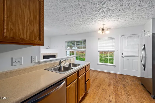 a kitchen that has a sink and a stove