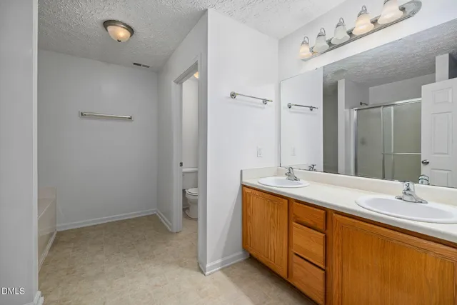 a bathroom with a sink vanity granite and mirror