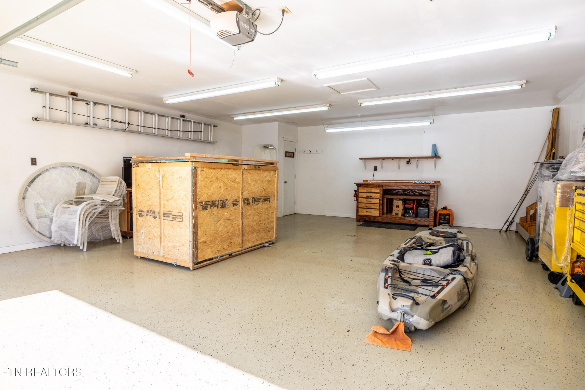 3941 Simpson Road Lenoir City, TN 37772 - Photo 32 of 35 a living room with furniture a flat screen tv and a couch