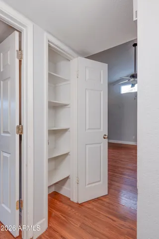 a view of a room with wooden floor
