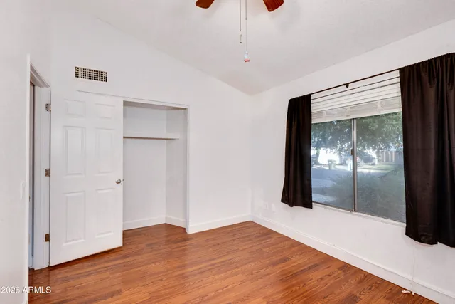 a view of hallway with wooden floor