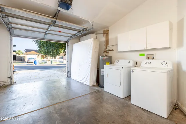 a view of a storage & utility room with washer and dryer