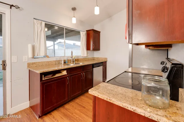 a kitchen with a sink and a refrigerator