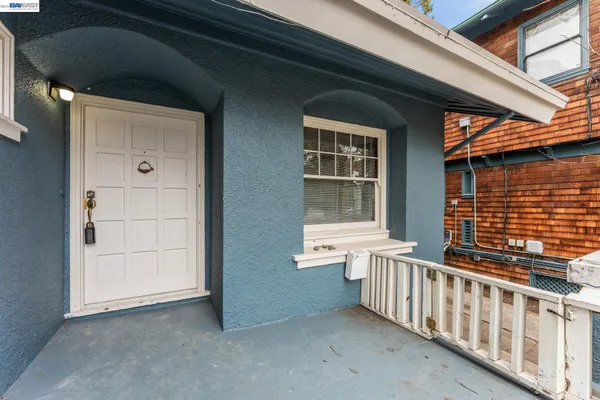 a view of a porch with wooden floor and fence