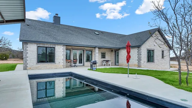 a view of house with yard