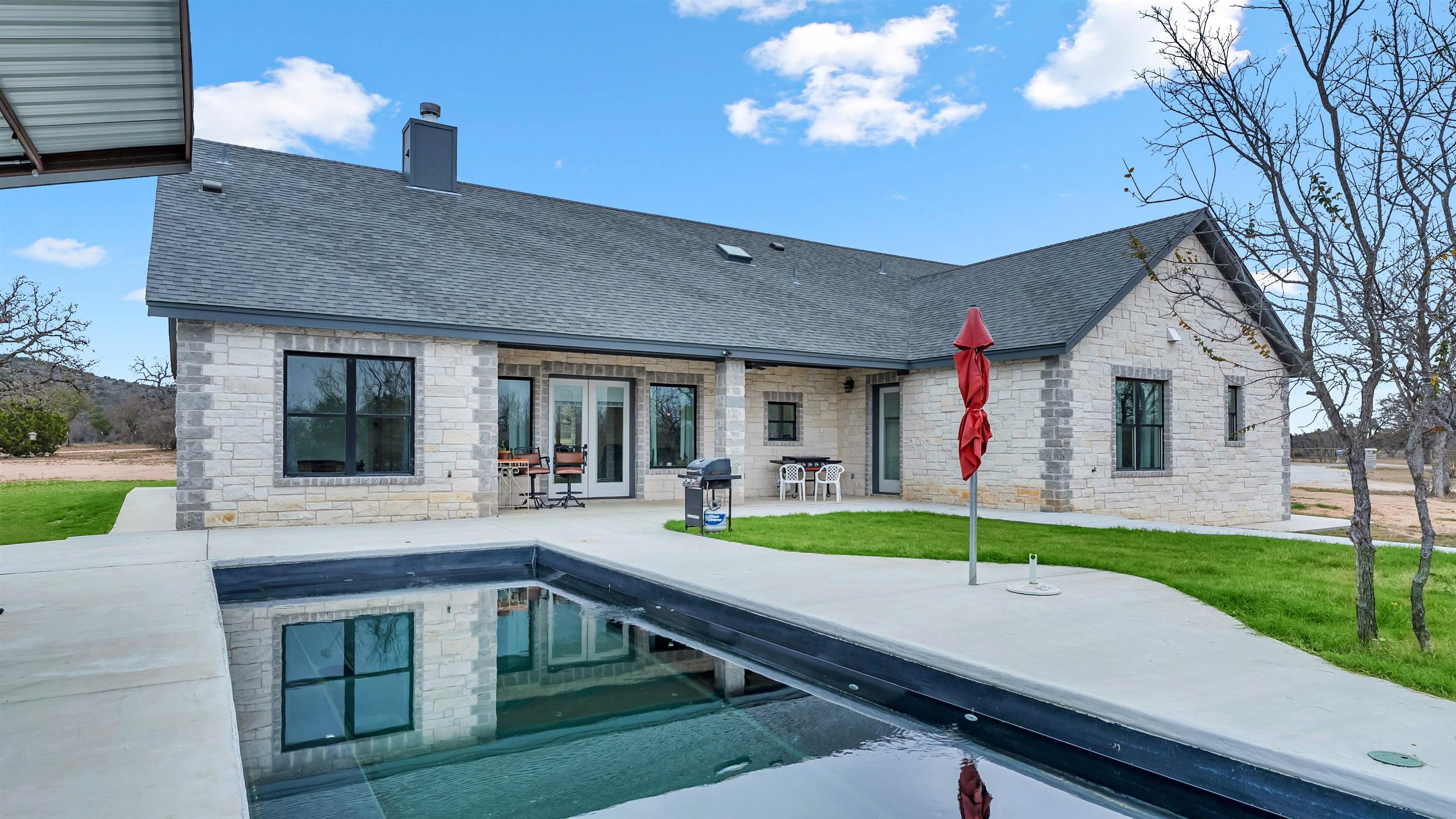 a view of house with yard
