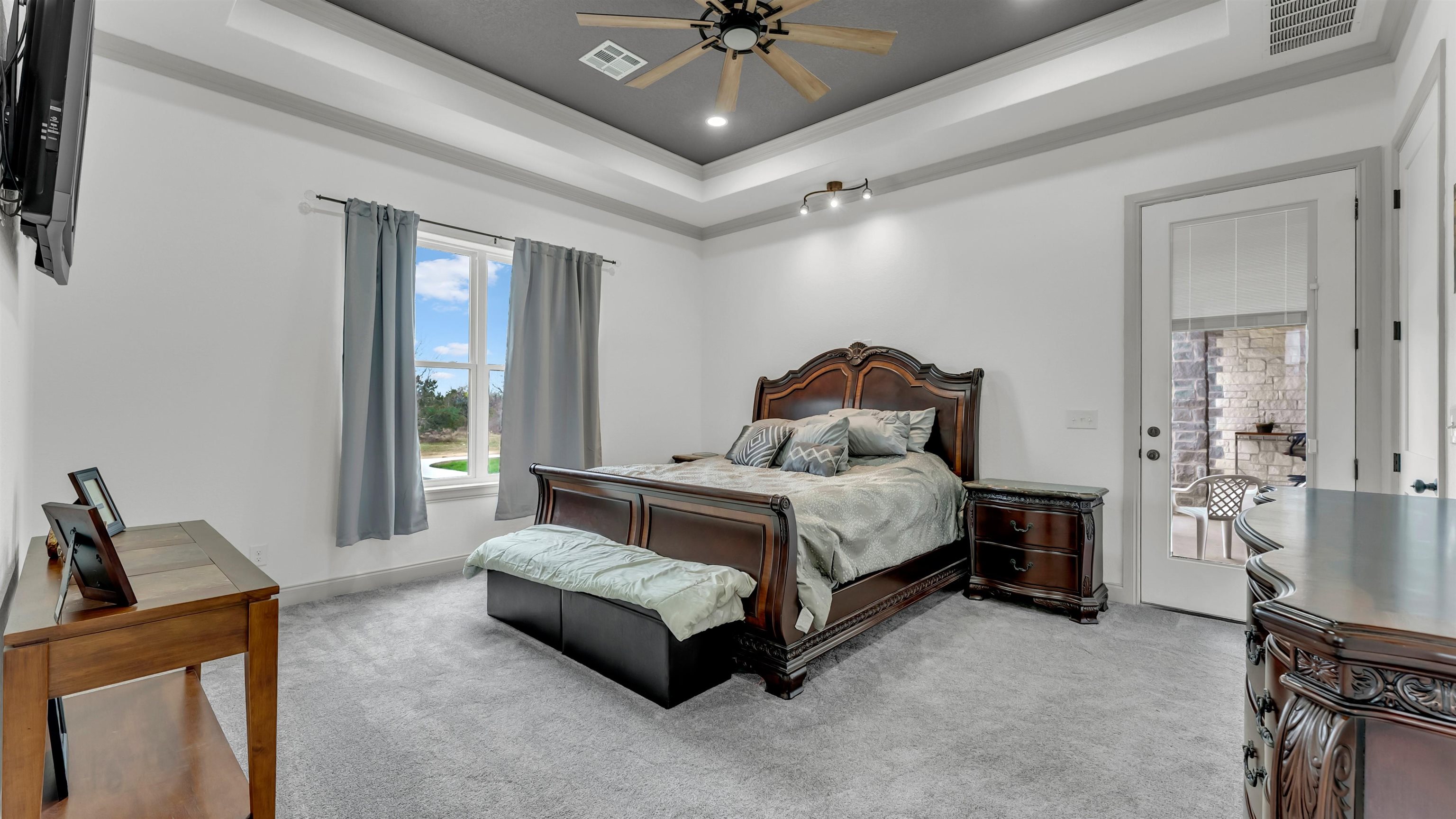 292 Oak Ridge Trail Kingsland, TX 78639 - Photo 16 of 29 a bedroom with a bed window and couch