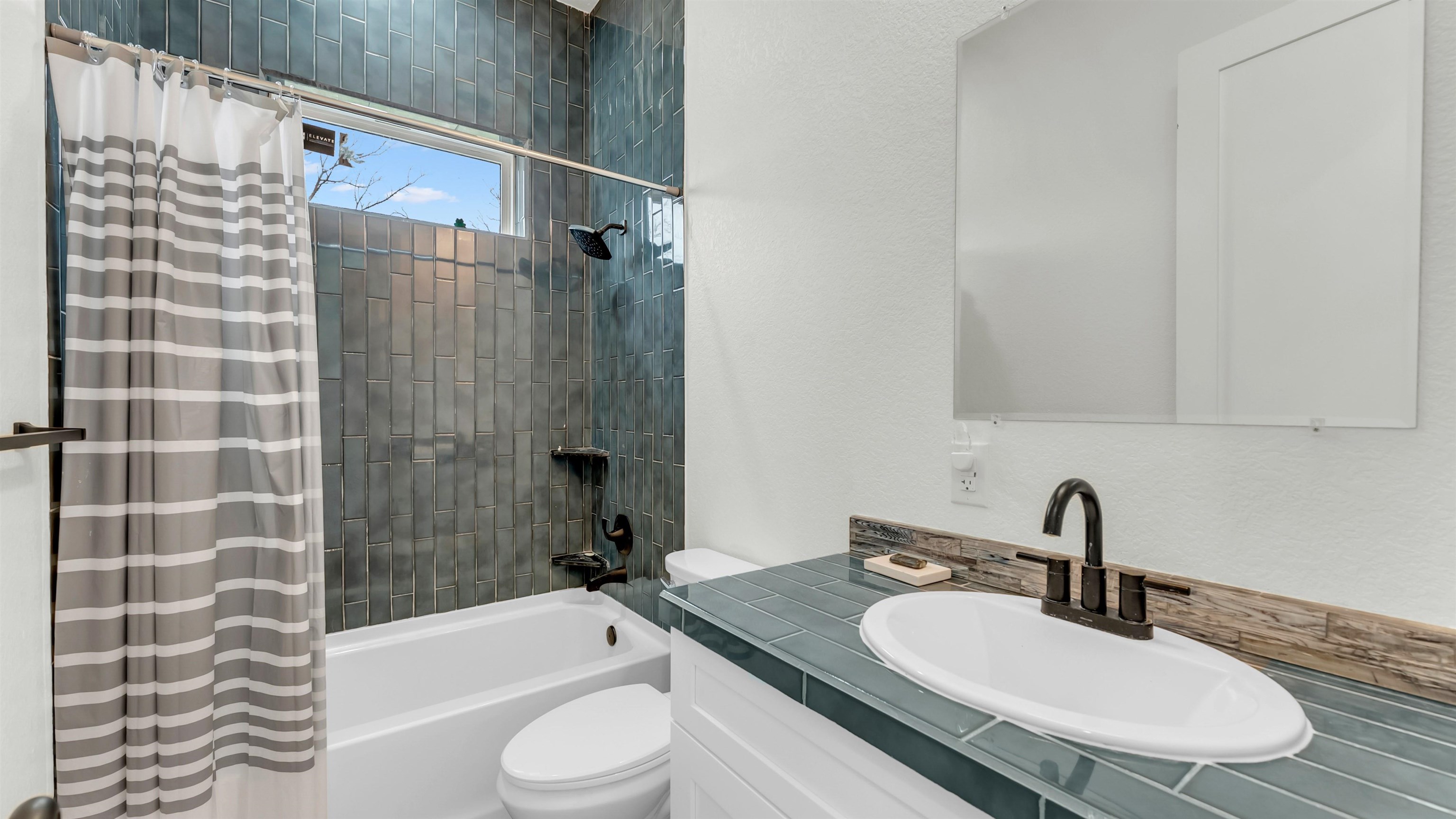 292 Oak Ridge Trail Kingsland, TX 78639 - Photo 21 of 29 a bathroom with a sink toilet and shower