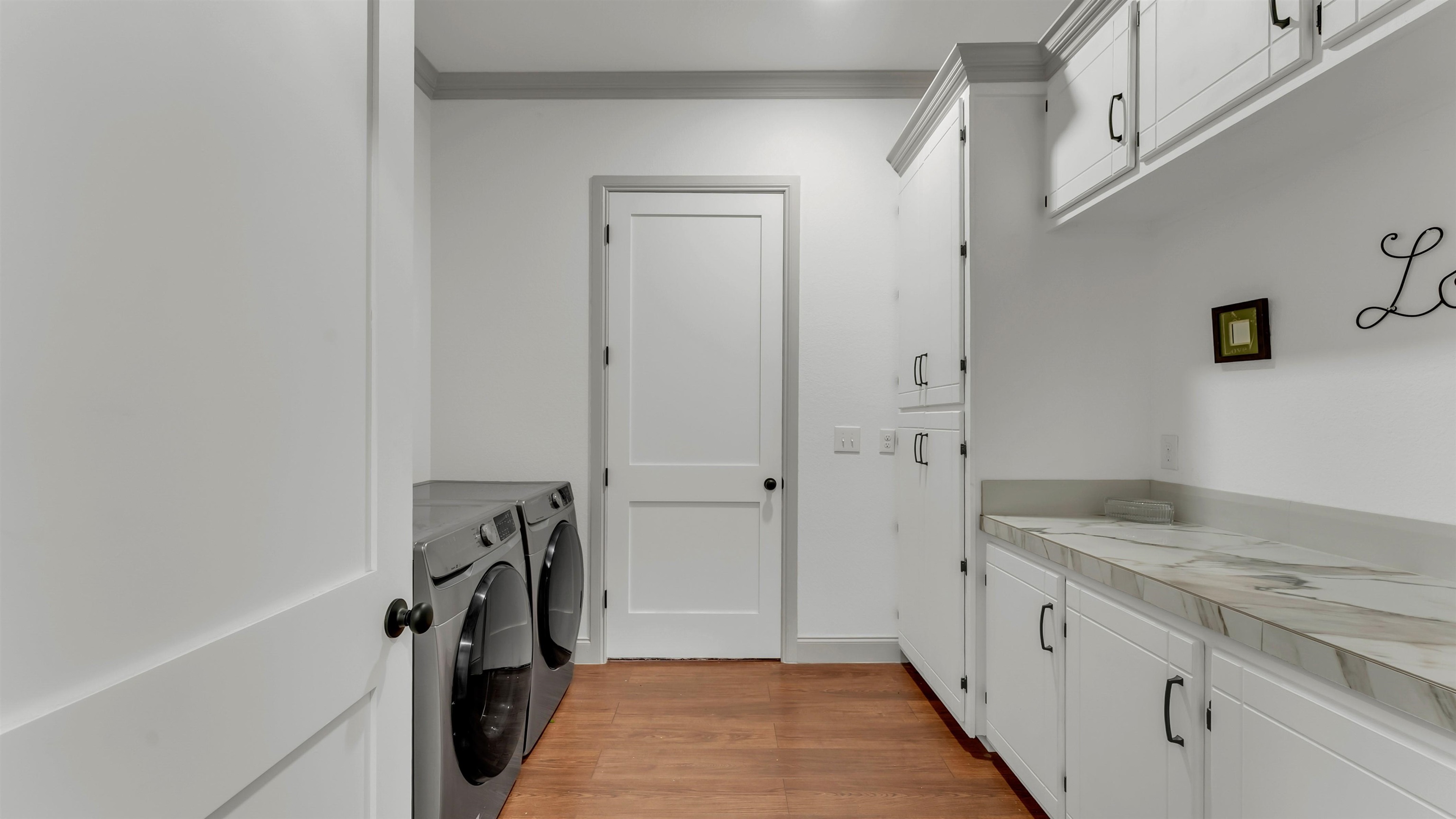 292 Oak Ridge Trail Kingsland, TX 78639 - Photo 23 of 29 a bathroom with a granite countertop sink and a refrigerator