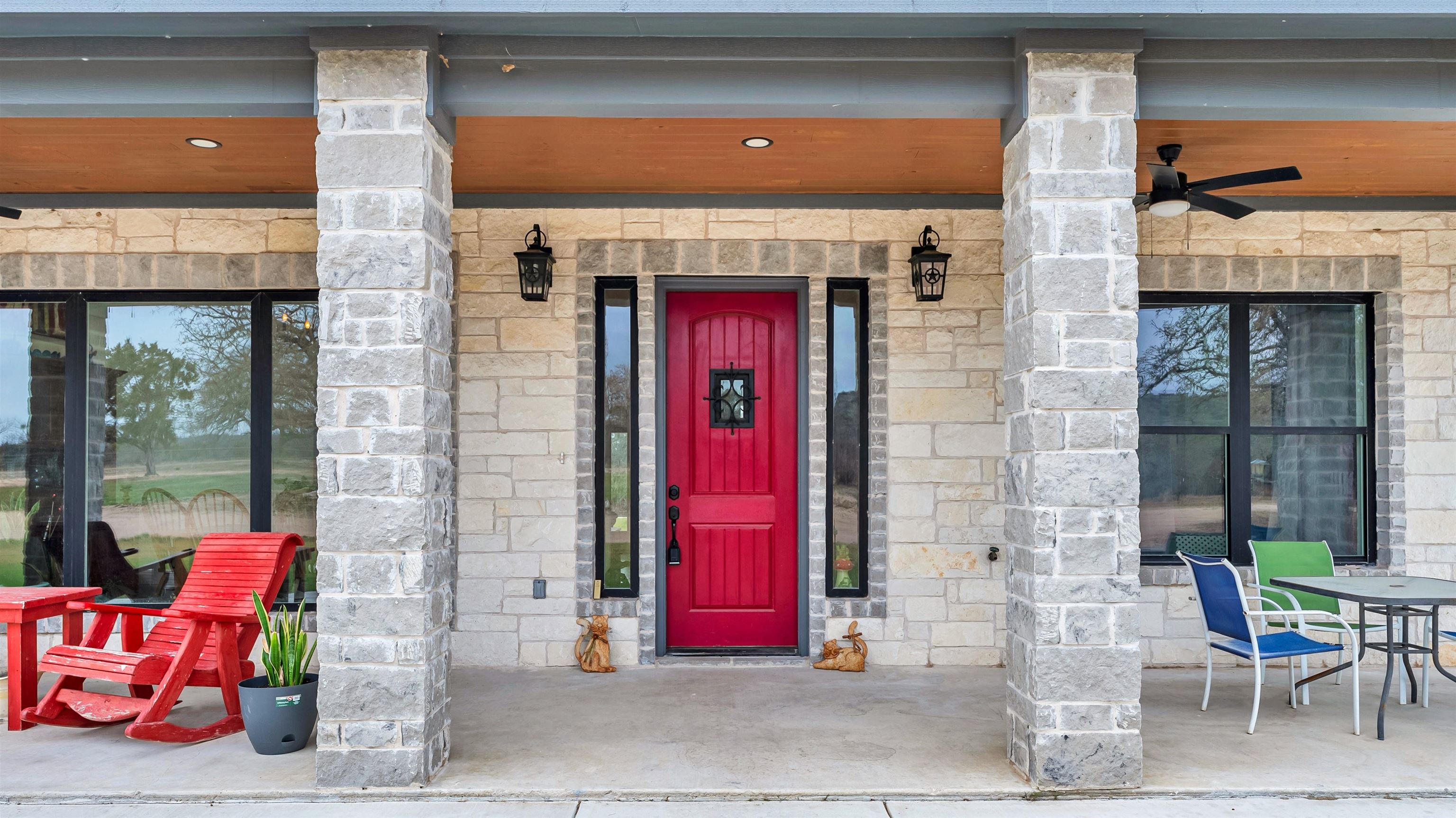 292 Oak Ridge Trail Kingsland, TX 78639 - Photo 5 of 29 a front view of a building with red door