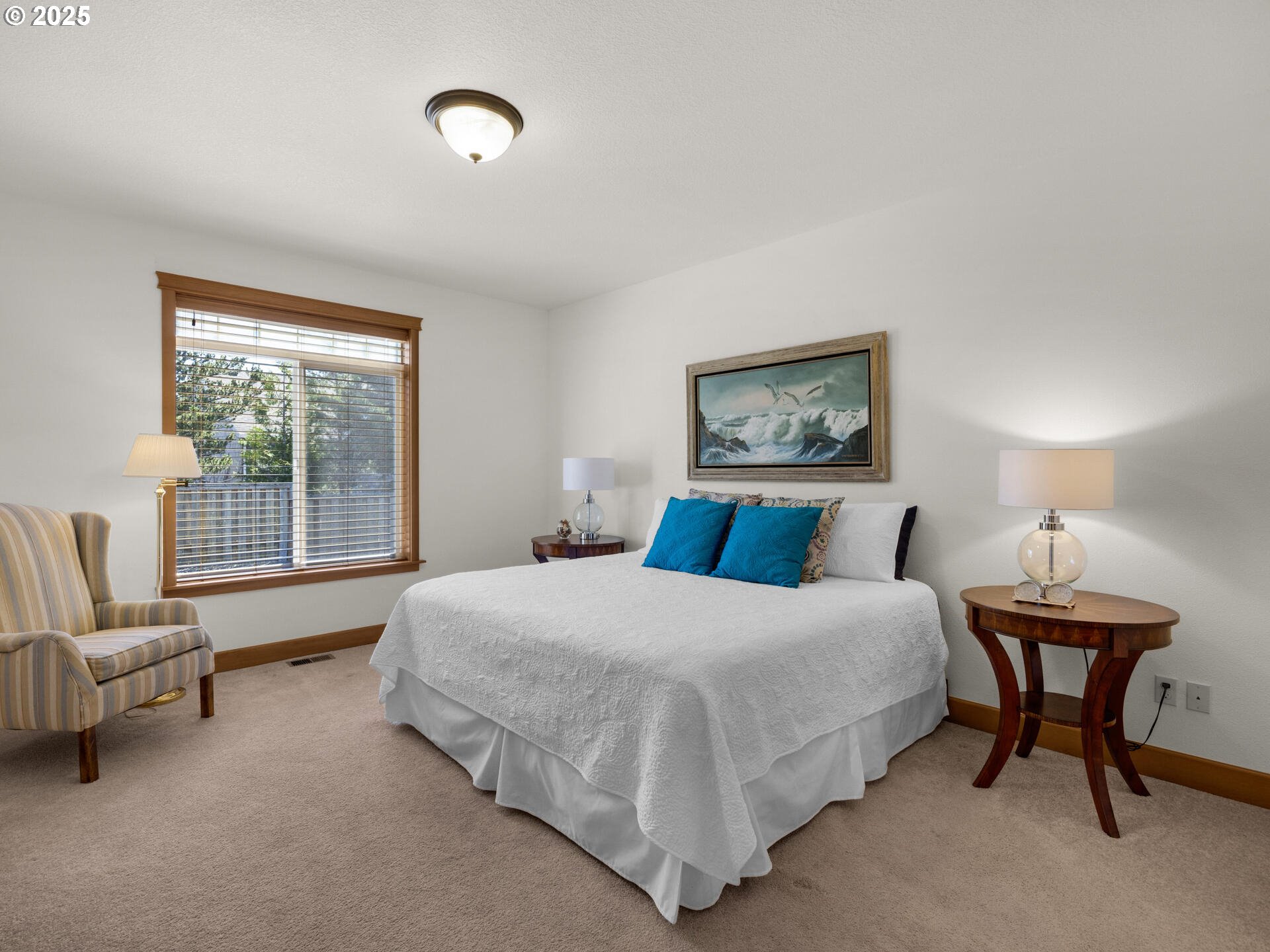 34535 Pinyon Drive Nehalem, OR 97131 - Photo 14 of 41 a bedroom with a bed and a couch