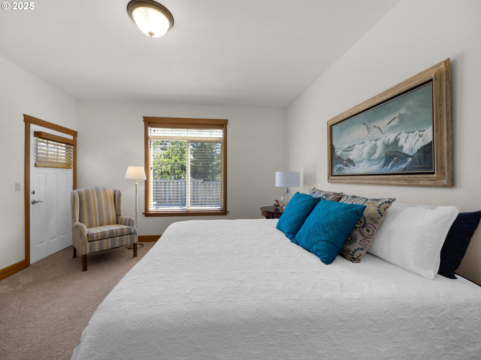 34535 Pinyon Drive Nehalem, OR 97131 - Photo 16 of 41 a bedroom with a large bed and a couch