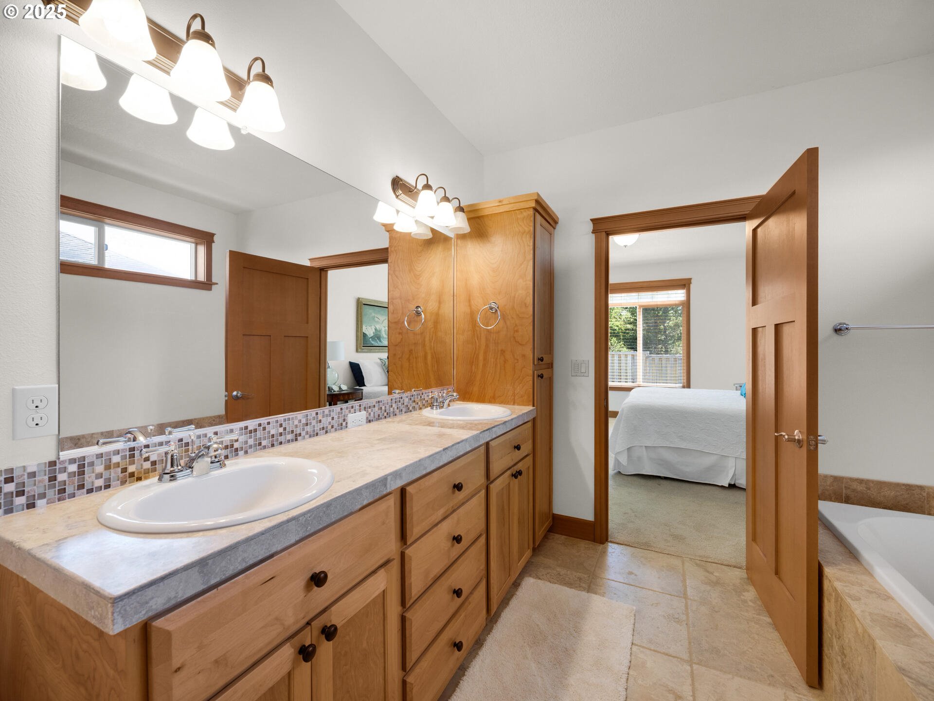 34535 Pinyon Drive Nehalem, OR 97131 - Photo 17 of 41 a spacious bathroom with a double vanity sink and a mirror