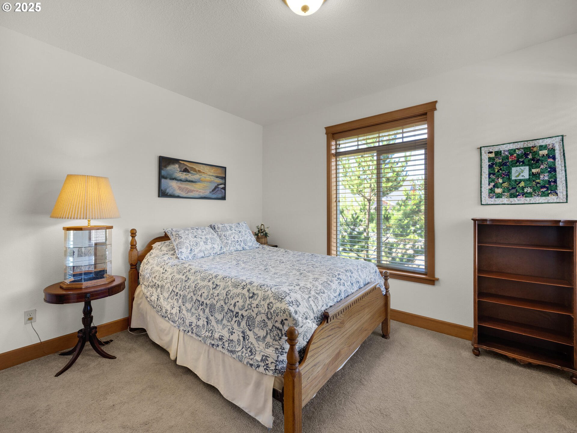 34535 Pinyon Drive Nehalem, OR 97131 - Photo 20 of 41 a bedroom with a bed and a window