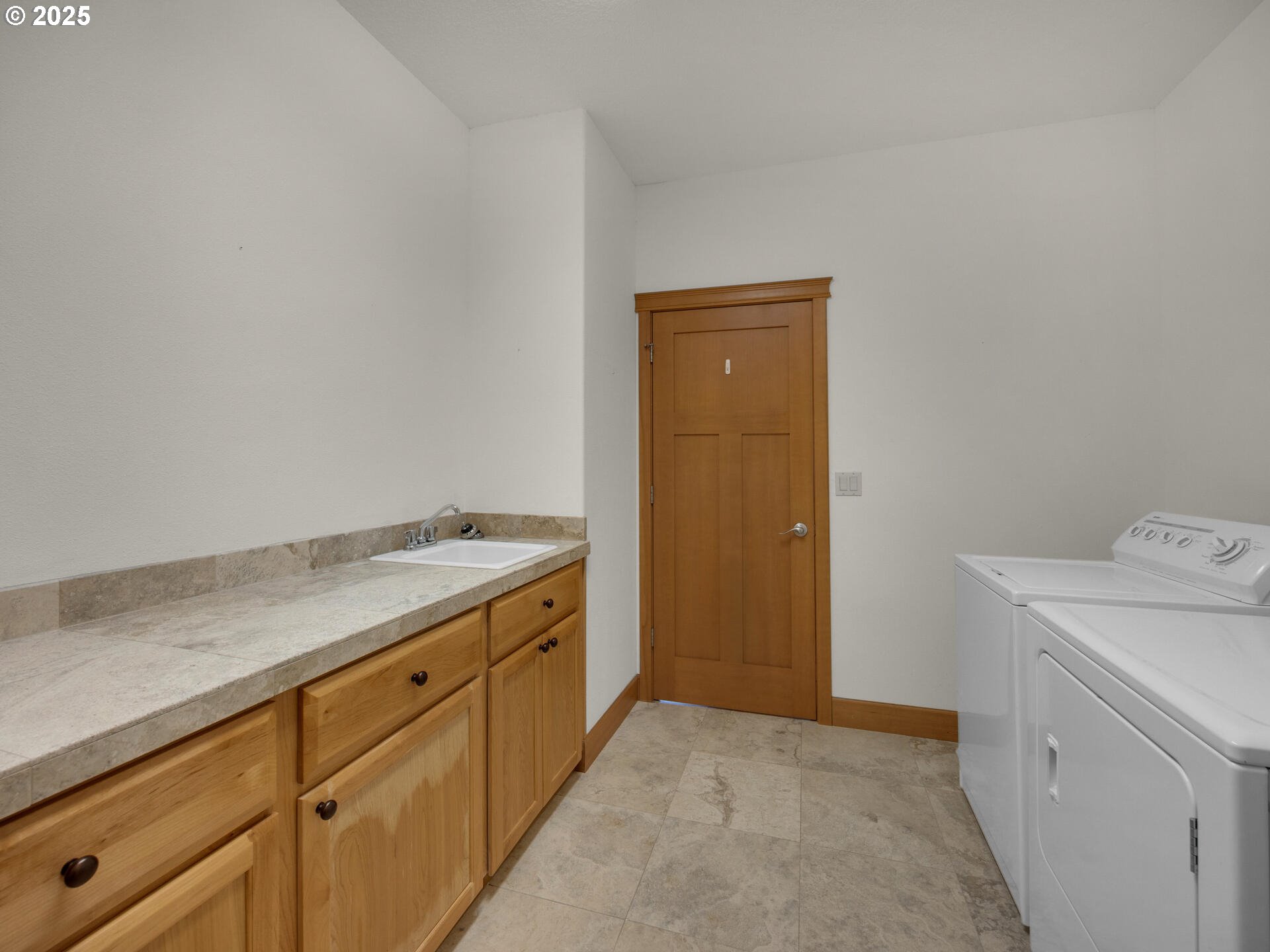 34535 Pinyon Drive Nehalem, OR 97131 - Photo 27 of 41 a utility room with cabinets washer and dryer