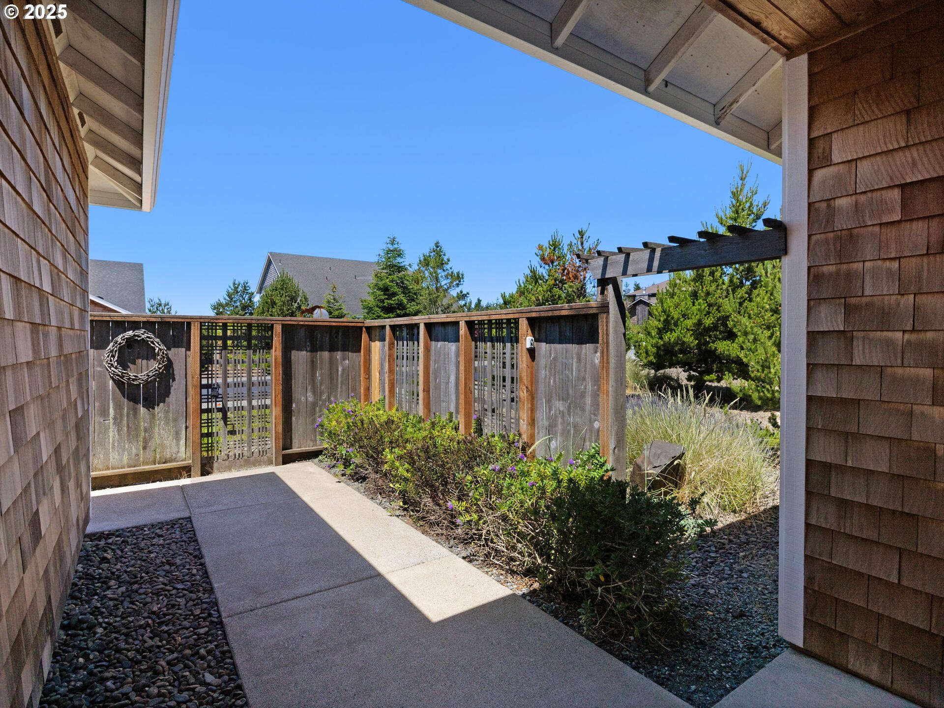 34535 Pinyon Drive Nehalem, OR 97131 - Photo 29 of 41 a view of balcony with wooden floor and potted plants