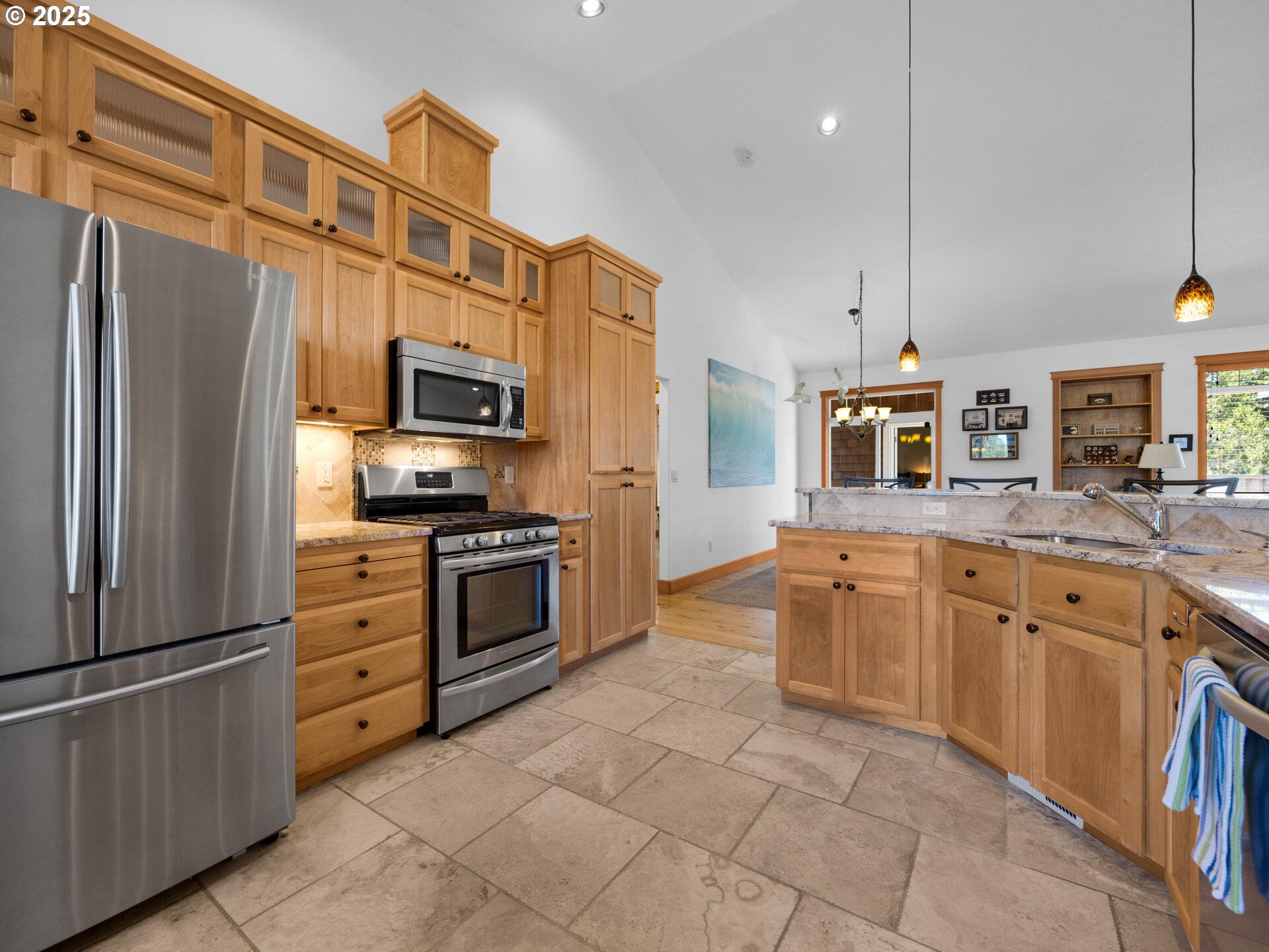 34535 Pinyon Drive Nehalem, OR 97131 - Photo 5 of 41 a kitchen with stainless steel appliances granite countertop a refrigerator a stove a sink and a microwave