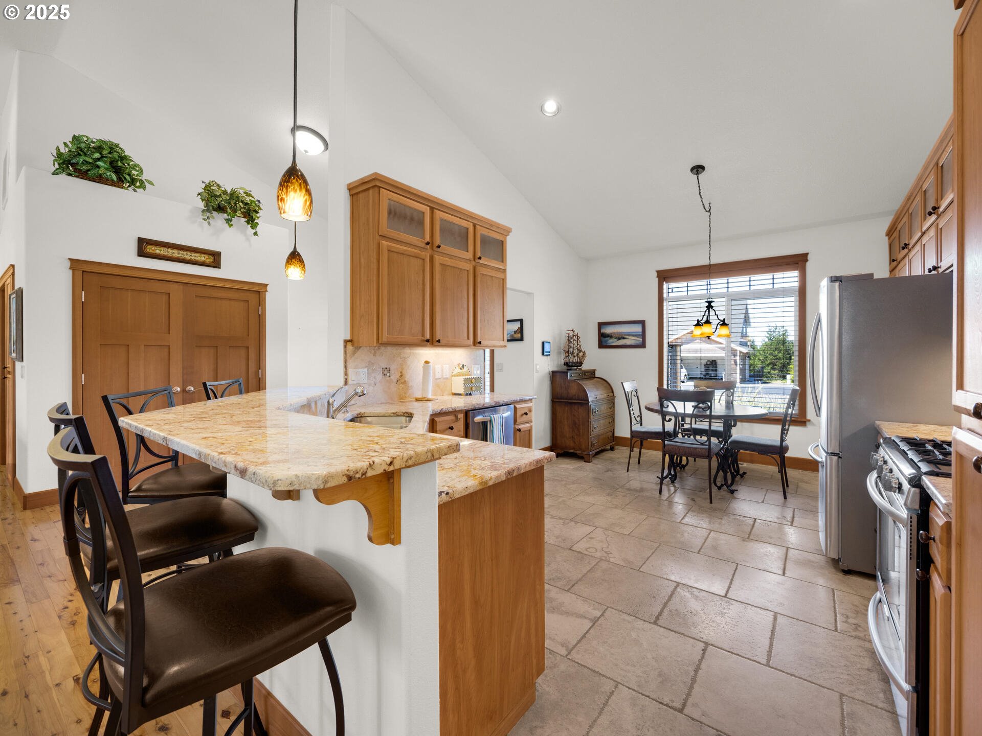 34535 Pinyon Drive Nehalem, OR 97131 - Photo 7 of 41 a view of kitchen with kitchen island dining table and chairs