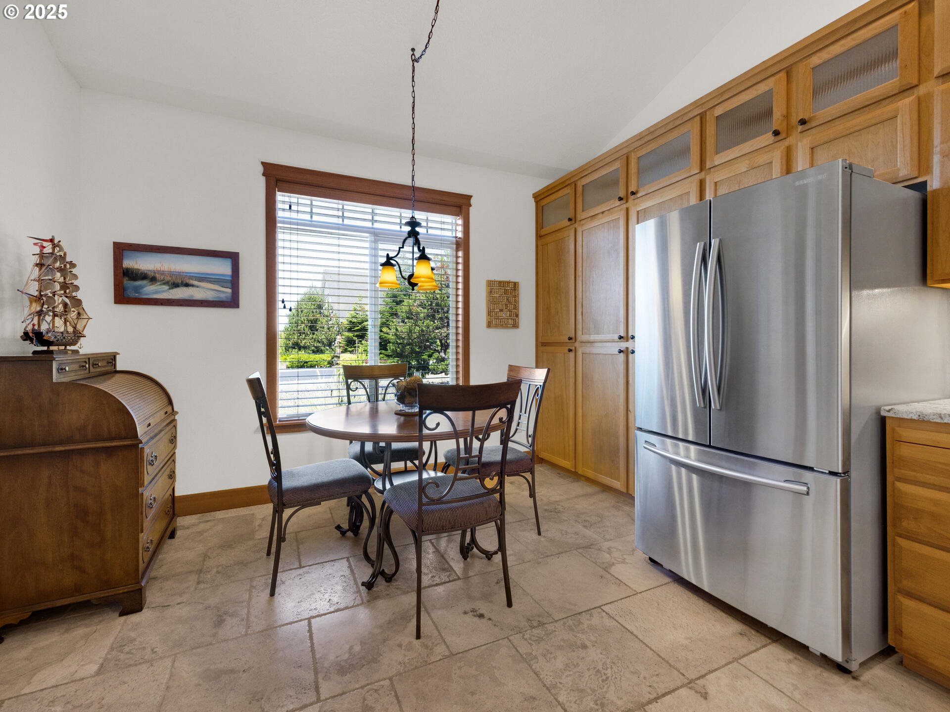 34535 Pinyon Drive Nehalem, OR 97131 - Photo 8 of 41 a dining table chair next to window and stainless steel appliances