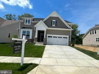 a front view of a house with yard