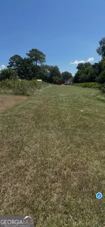 a view of a lake with houses in the back