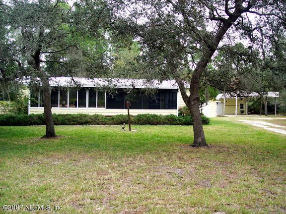 110 Bayberry Road Georgetown, FL 32139 - Photo 1 of 17 a view of a tree in front of a house