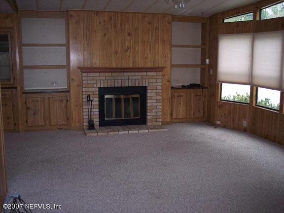 110 Bayberry Road Georgetown, FL 32139 - Photo 6 of 17 a view of a livingroom with a fireplace