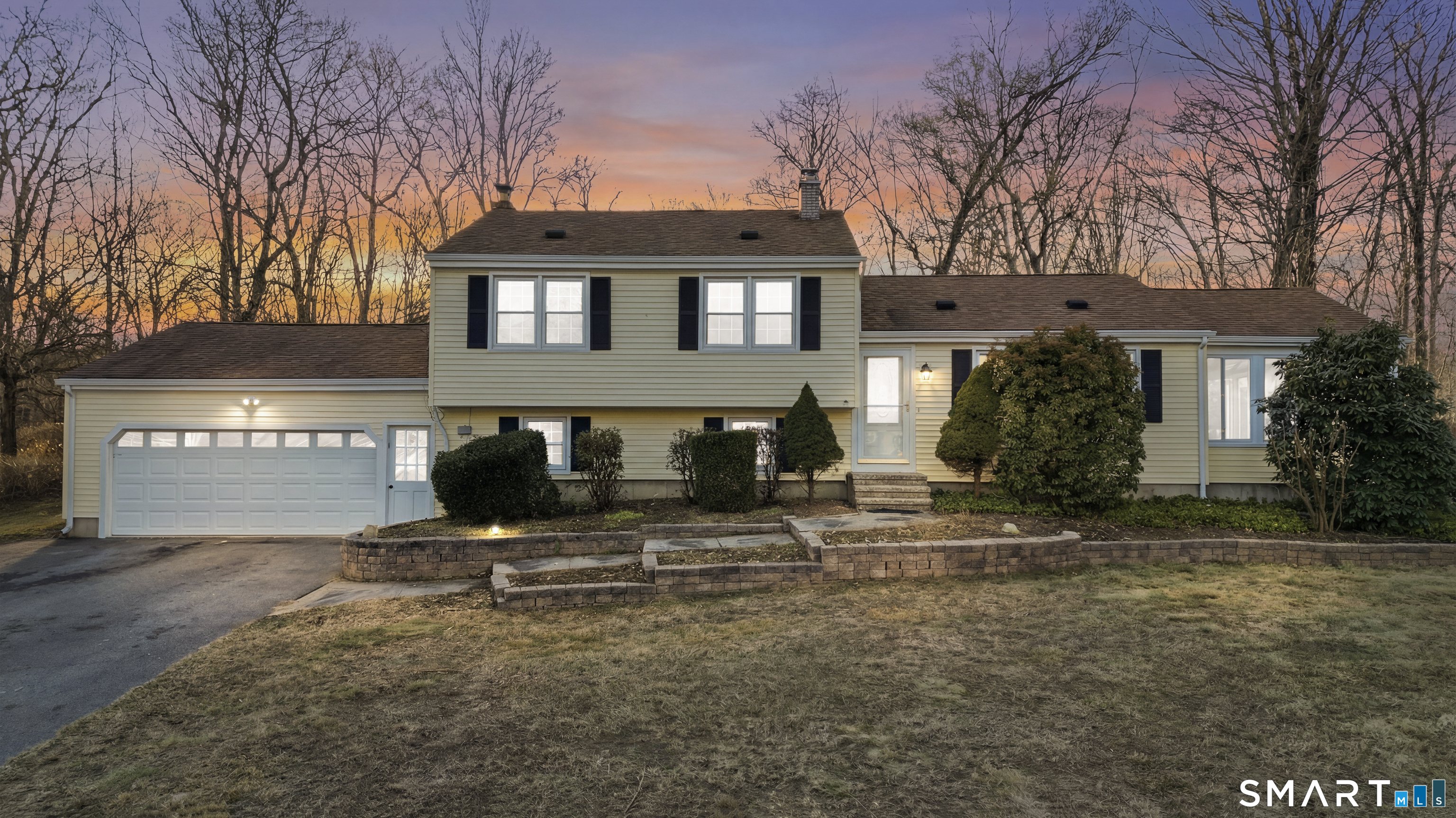 a front view of a house with a yard