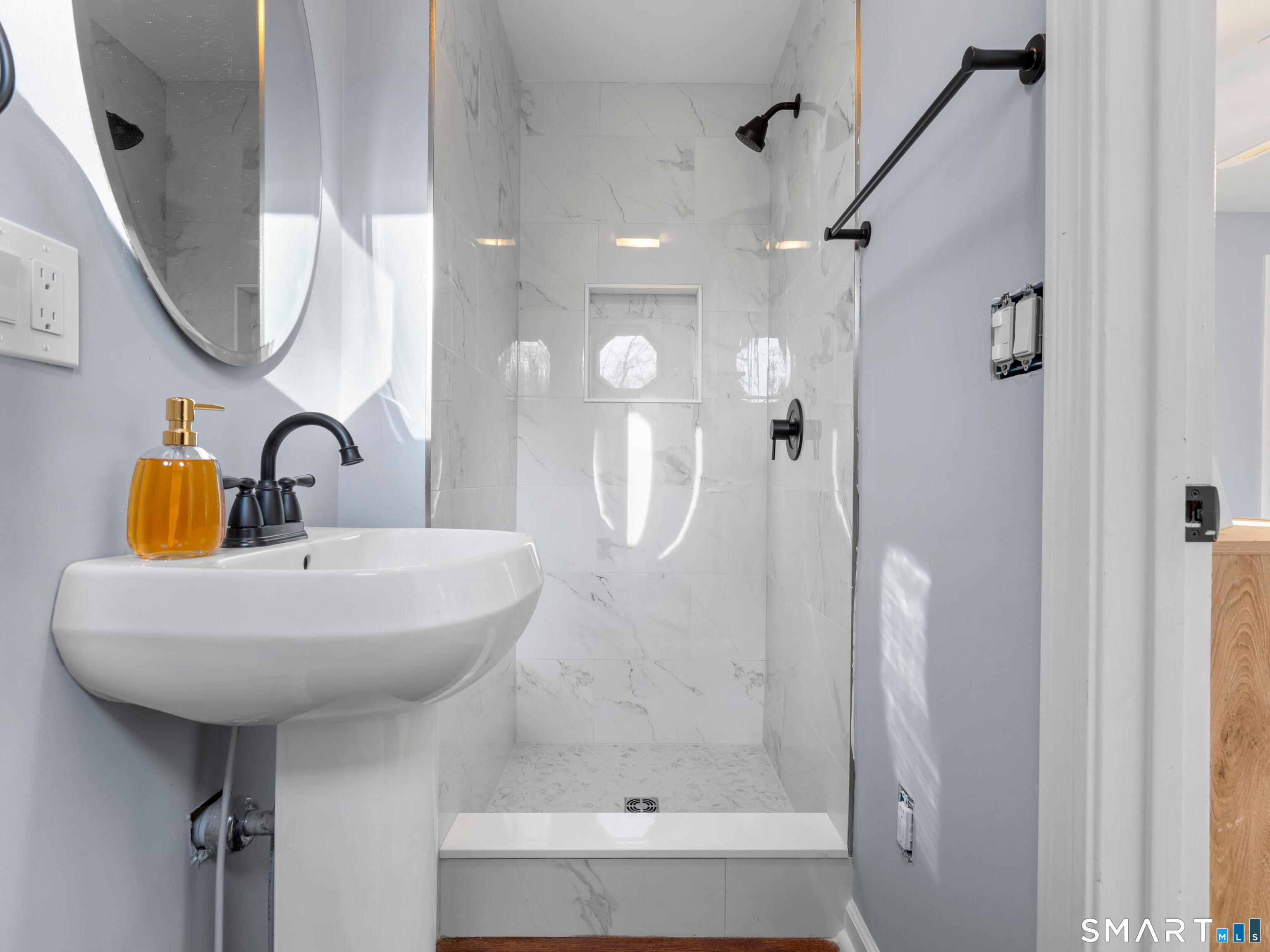 7 Coach Light Drive Clinton, CT 06413 - Photo 15 of 26 a bathroom with a sink a toilet and shower