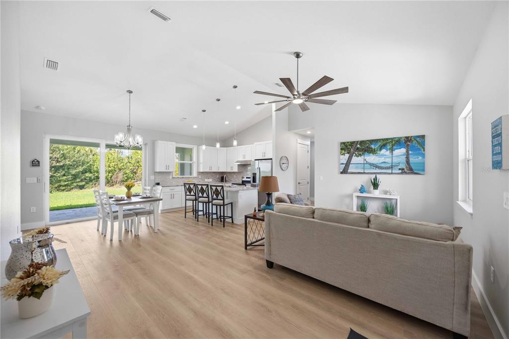 10443 Riverside Road Port Charlotte, FL 33981 - Photo 2 of 64 a living room with furniture and a large window