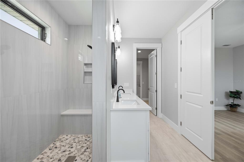 10443 Riverside Road Port Charlotte, FL 33981 - Photo 21 of 64 a bathroom with a sink and a mirror