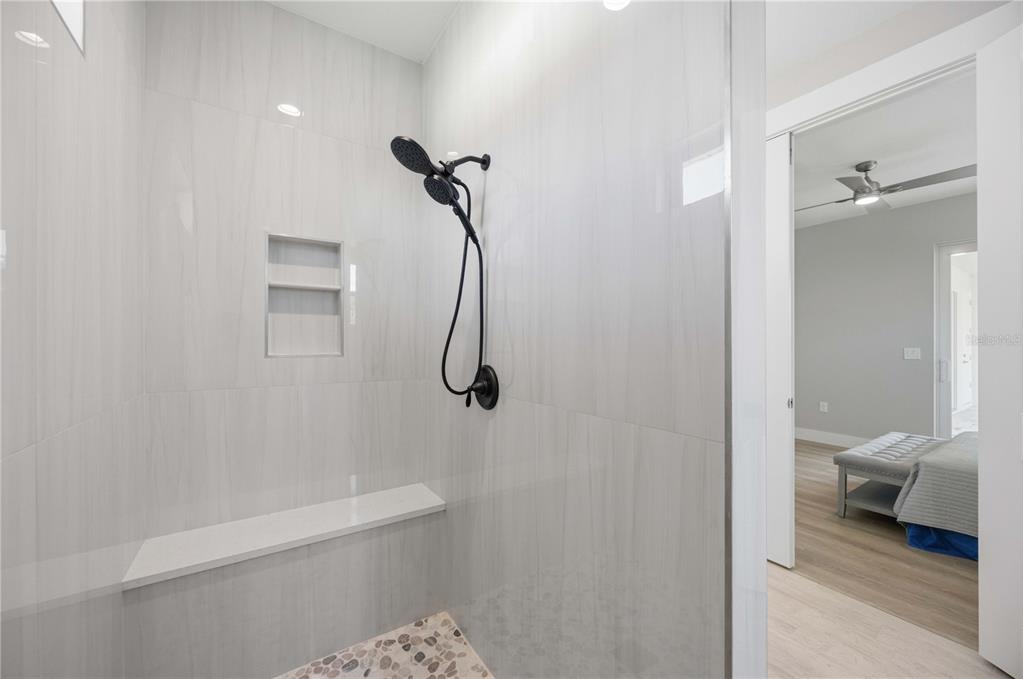10443 Riverside Road Port Charlotte, FL 33981 - Photo 22 of 64 a bathroom with a granite countertop shower and a toilet