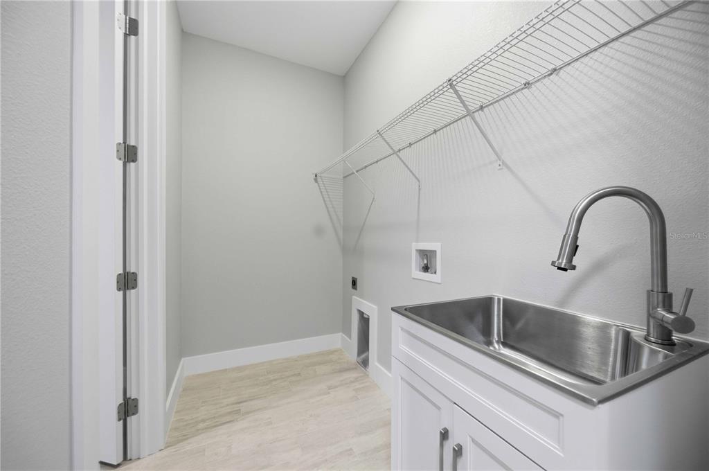 10443 Riverside Road Port Charlotte, FL 33981 - Photo 26 of 64 a close view of sink and tap