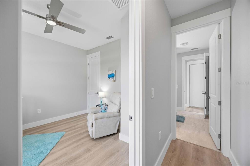 10443 Riverside Road Port Charlotte, FL 33981 - Photo 27 of 64 a bathroom with a bathtub and a hallway