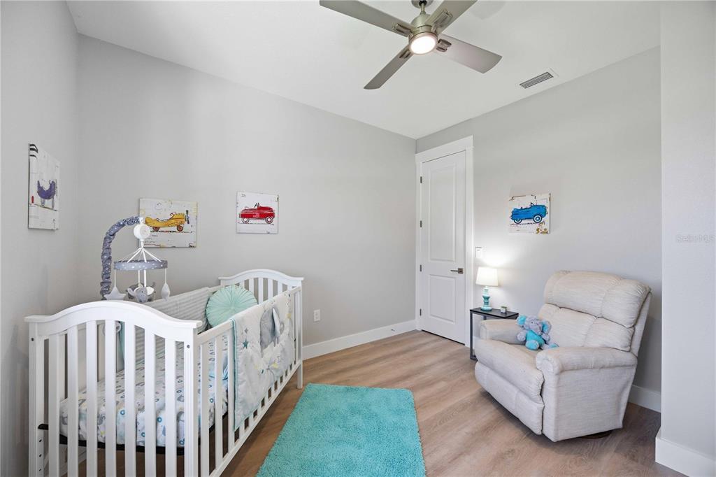 10443 Riverside Road Port Charlotte, FL 33981 - Photo 29 of 64 a bedroom with furniture and a bed