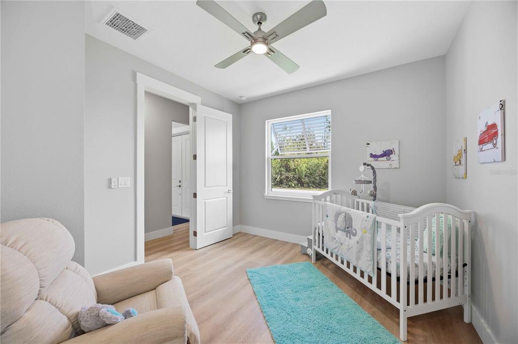 10443 Riverside Road Port Charlotte, FL 33981 - Photo 30 of 64 a bedroom with furniture and a window