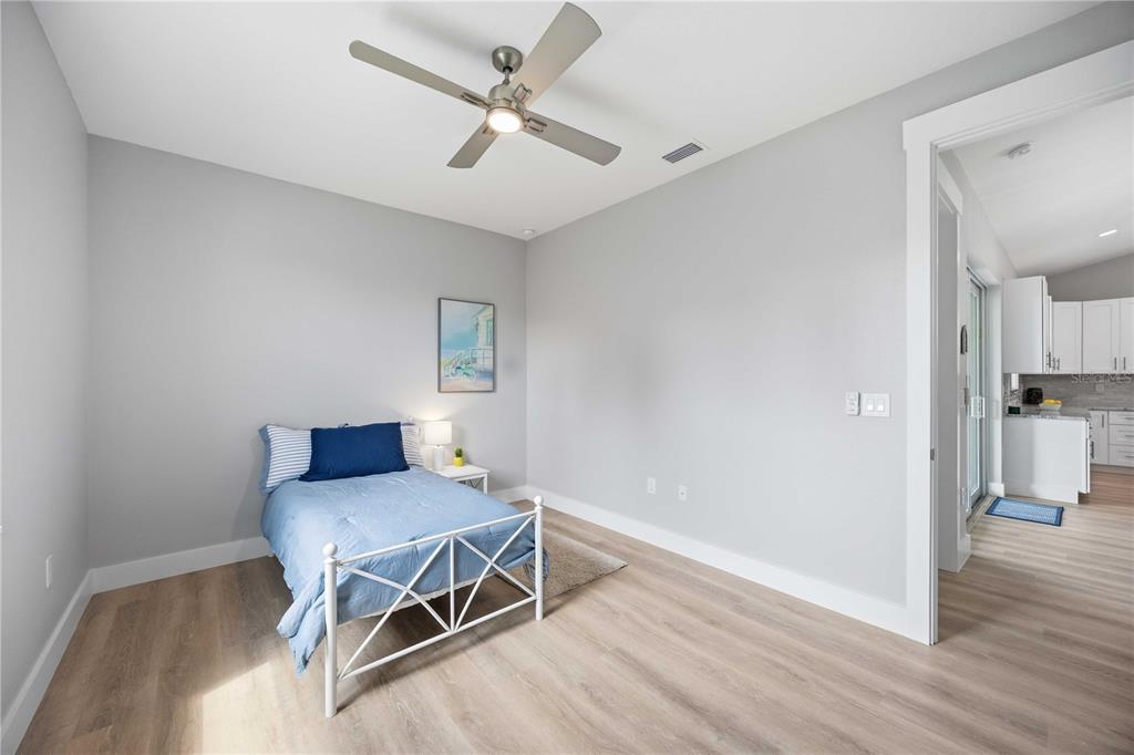 10443 Riverside Road Port Charlotte, FL 33981 - Photo 35 of 64 a living room with furniture and a wooden floor