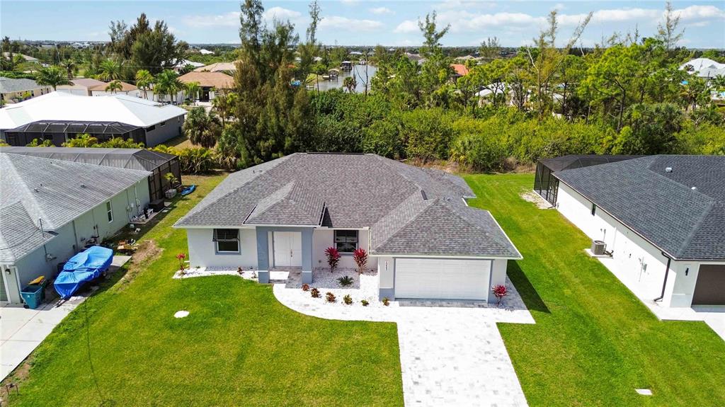 10443 Riverside Road Port Charlotte, FL 33981 - Photo 47 of 64 an aerial view of a house with swimming pool garden and patio