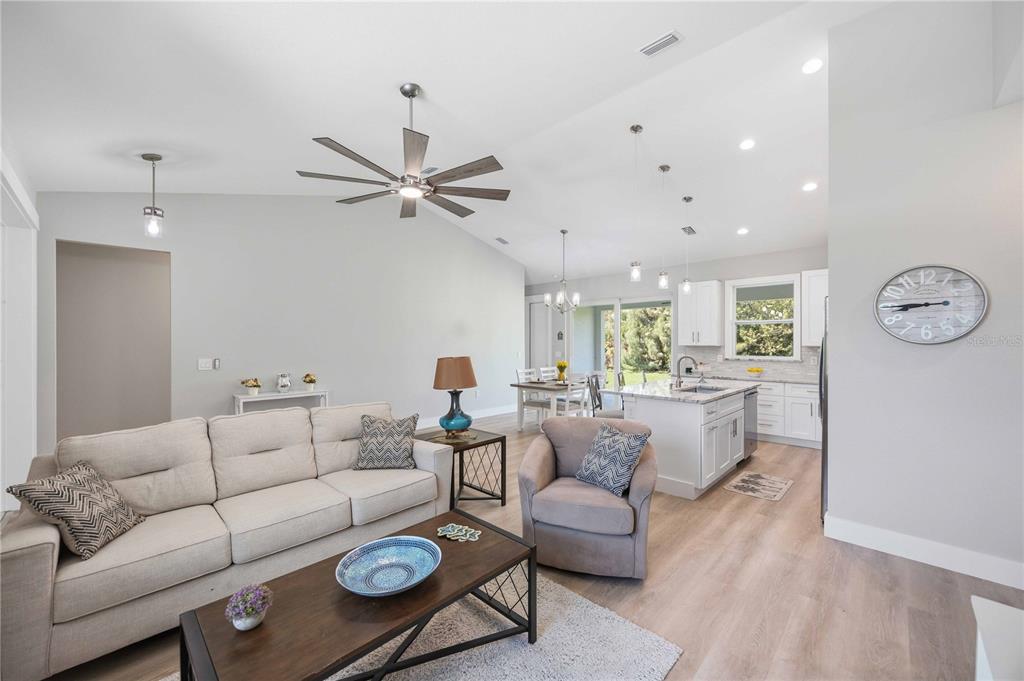 10443 Riverside Road Port Charlotte, FL 33981 - Photo 5 of 64 a living room with furniture and a table
