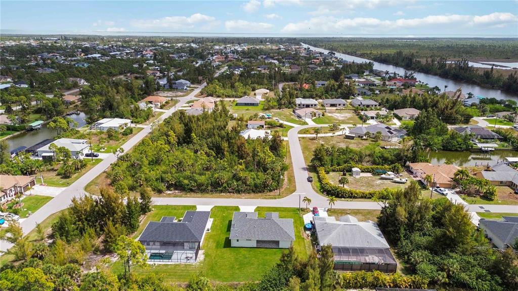 10443 Riverside Road Port Charlotte, FL 33981 - Photo 53 of 64 an aerial view of residential houses with outdoor space
