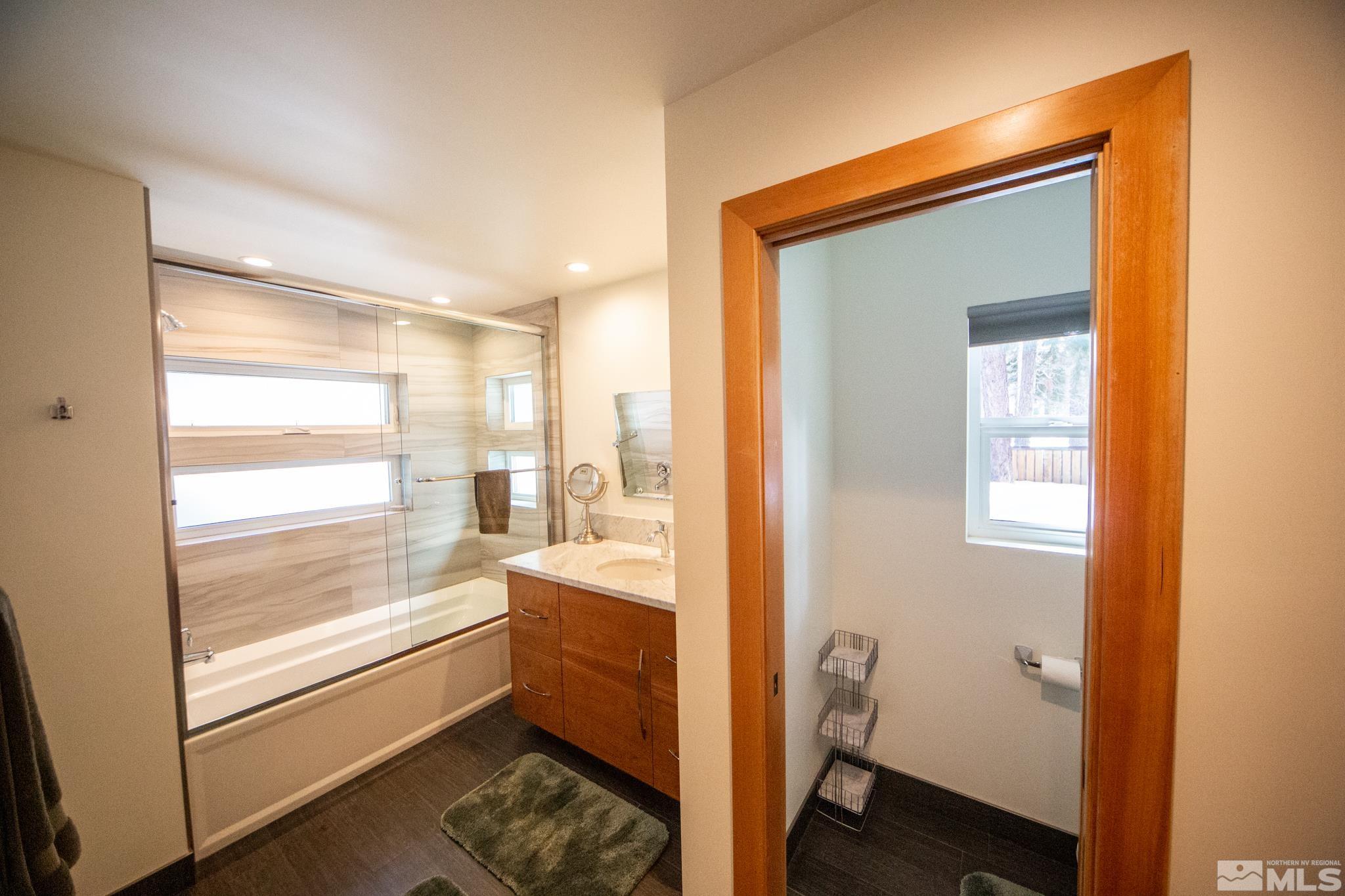 301 Cedar Drive Stateline, NV 89449 - Photo 14 of 27 a bathroom with a bathtub and a sink