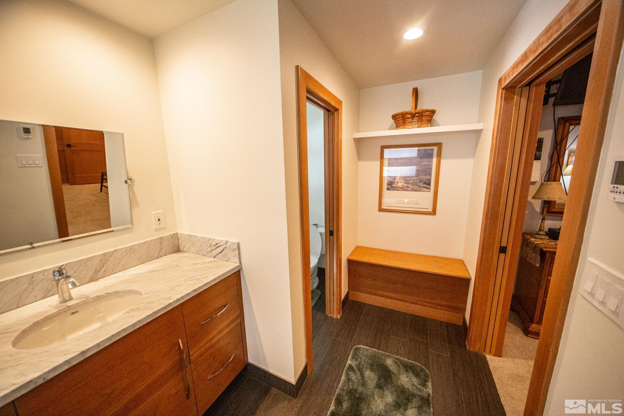 301 Cedar Drive Stateline, NV 89449 - Photo 16 of 27 a bathroom with a sink and a mirror
