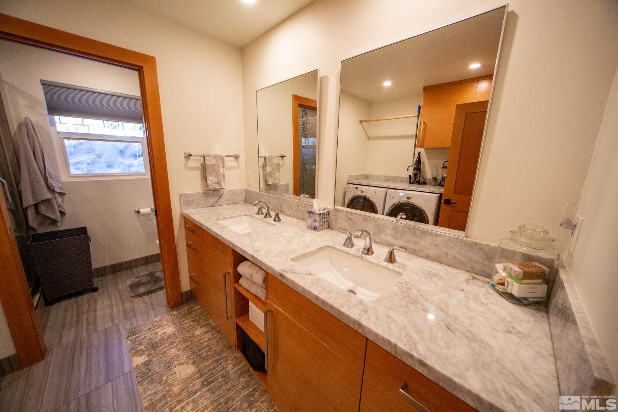 301 Cedar Drive Stateline, NV 89449 - Photo 10 of 27 a bathroom with a double vanity sink and a mirror