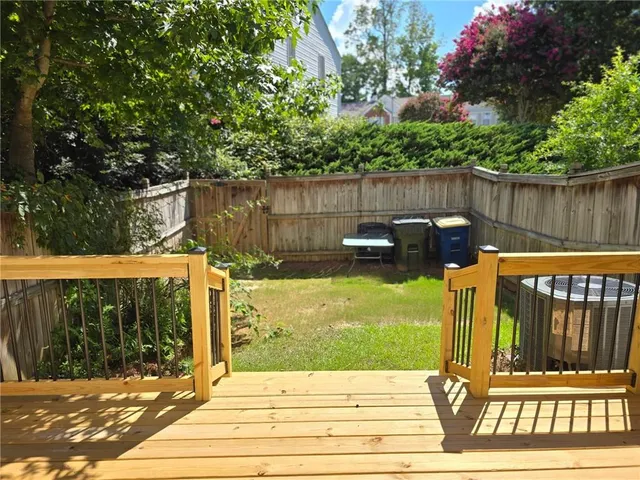 a view of a backyard with a deck