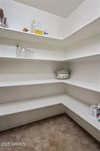 a kitchen with a cabinets and steel stainless steel appliances