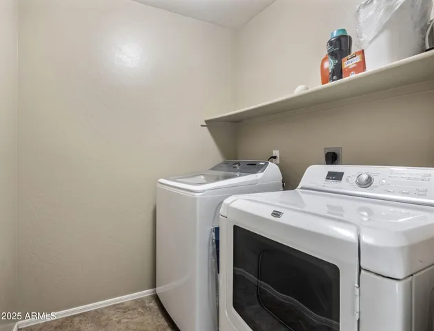 a bedroom with furniture and windows