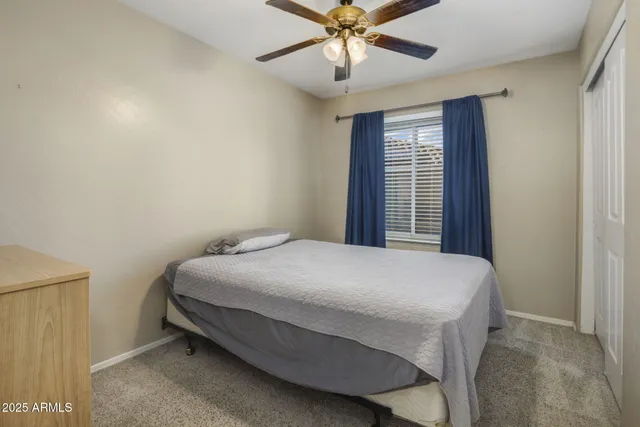 a bedroom with a bed and a table