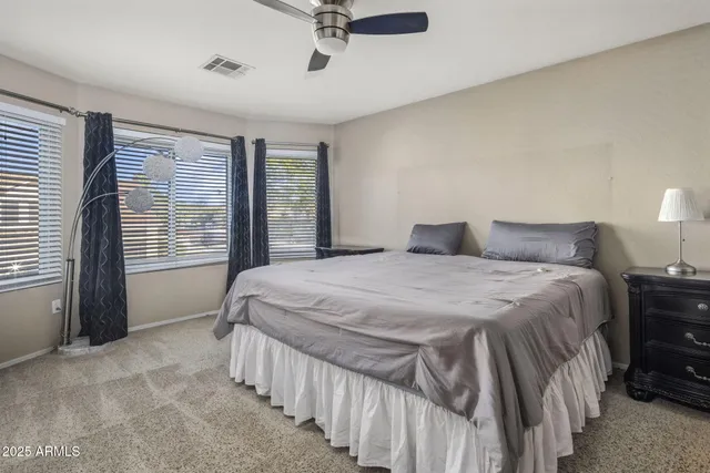 a bedroom with a bed and a cabinets