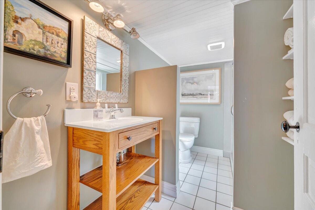 7758 Old Fincastle Road Fincastle, VA 24090 - Photo 34 of 99 a bathroom with a sink mirror and vanity